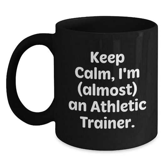 Funny Gifts for Athletic Trainer Friends and Family, Black Coffee Mug Keep Calm I'm Almost An Athletic Trainer - Main