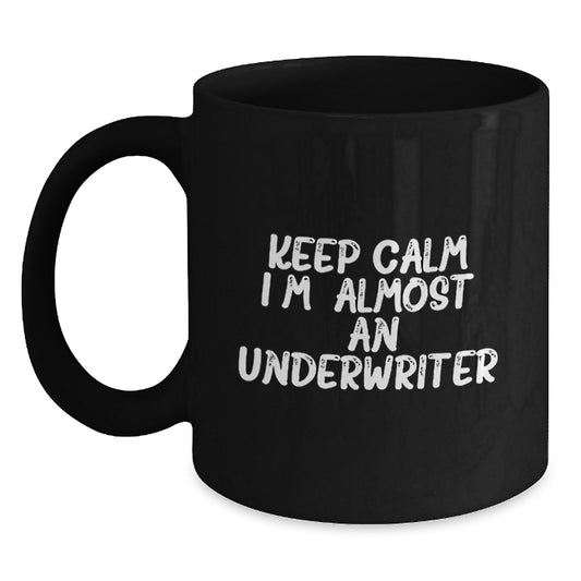 Funny Underwriter Gifts for Christmas, 'Keep Calm I'm (almost) An Underwriter' Black Coffee Mug Gifts from Friends to Underwriter - Main