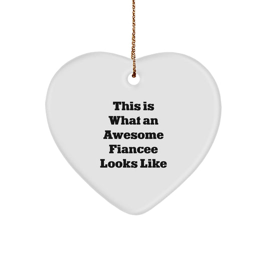 Funny Fiancee Gifts from Men for Christmas - Heart Ornament Quote "This Is What An Awesome Fiancee Looks Like" - Heart Shaped White Ornament for Fiancee - Image 1