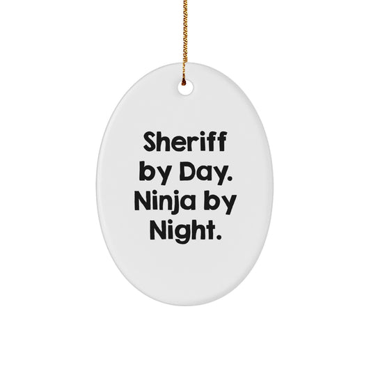 Sheriff Gifts for Men Christmas Unique Oval Ornament, 'Sheriff By Day. Ninja By Night.' Funny Quote, White, MDF, Sublimation Printed, Gold Cord Included - Image 1